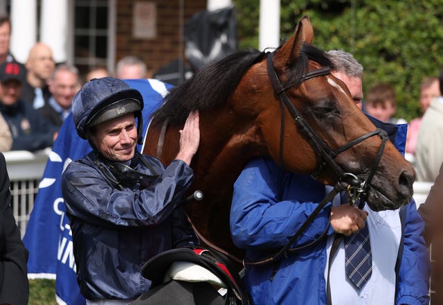 City Of Troy and jockey Ryan Moore after winning the Coral-Eclipse