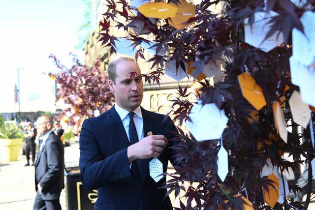 The Duke of Cambridge leaves a message on a ‘Tree of Hope’ (Paul Ellis/PA)