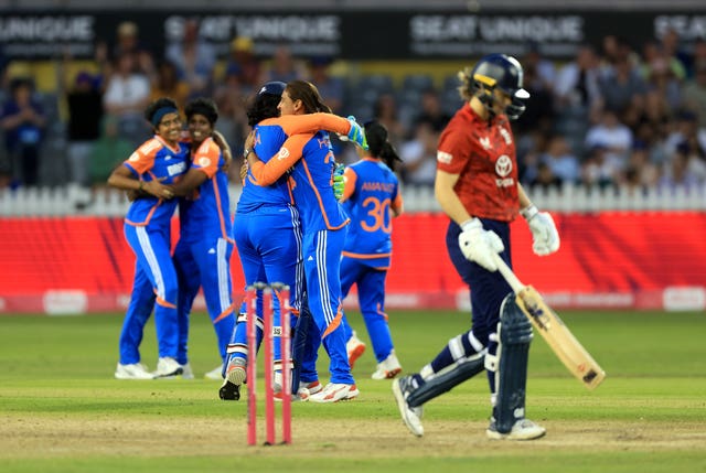 India celebrate claiming an England wicket