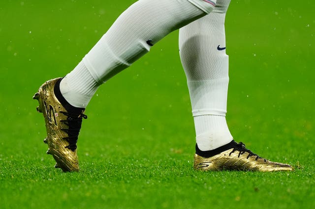 Close-up view of Harry Kane''s gold boots to mark his 100th England cap