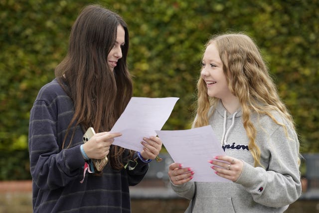 Nikita Hoawrd, 18, left, and Skye Paterson, 18, share their results for their T-levels at Peter Symonds College, Winchester, Hampshire 
