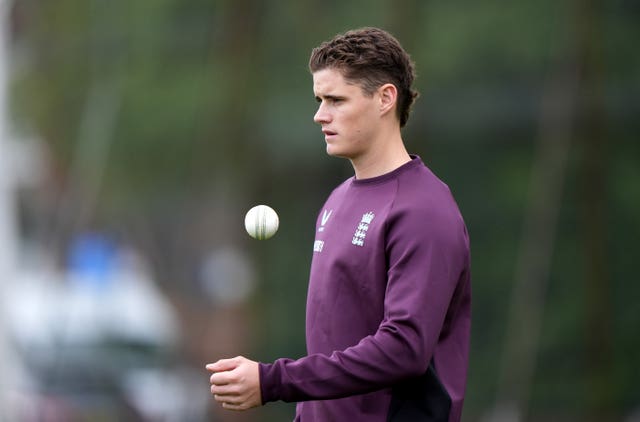 Jacon Bethell tosses a ball at England training.