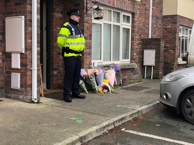 Floral tributes at the house in Newcastle, south-west of Dublin city