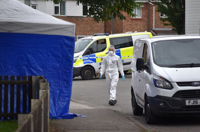 Forensic officers are working at the scene
