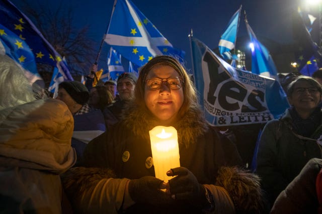 Pro-EU campaigners take part in a Missing EU Already rally outside the Scottish Parliament in Edinburgh