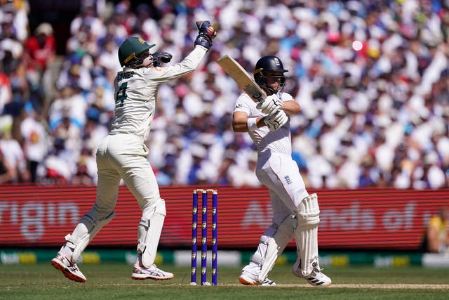 Jacob Bethell (right) bats with Alex Carey close by