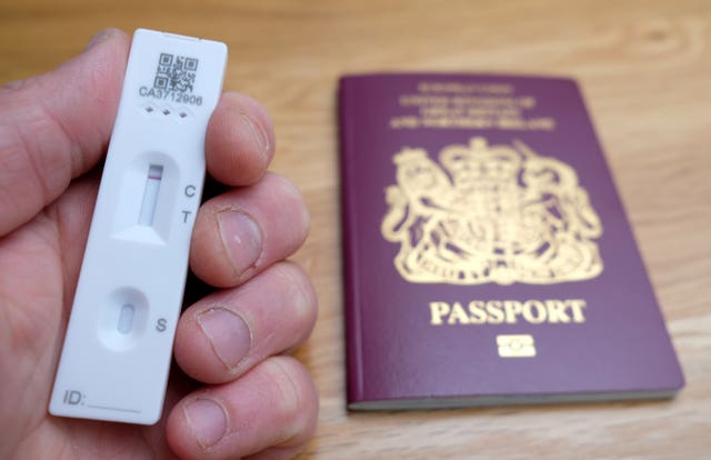 Later in October, eligible fully vaccinated passengers can take a cheaper lateral flow test instead of a PCR test as their day two test (Andrew Matthews/PA)