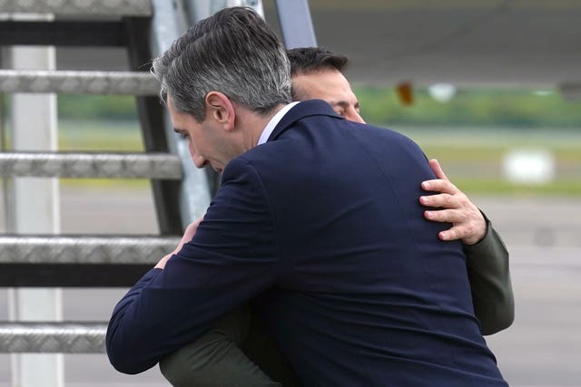 Volodymyr Zelensky and Simon Harris hug at Shannon Airport