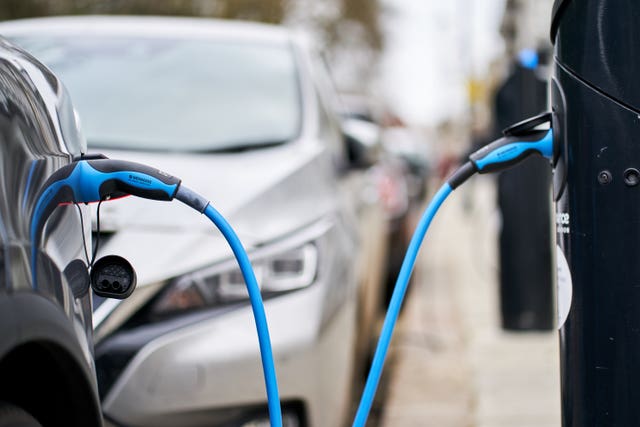 A Tesla car plugged into a chargepoint