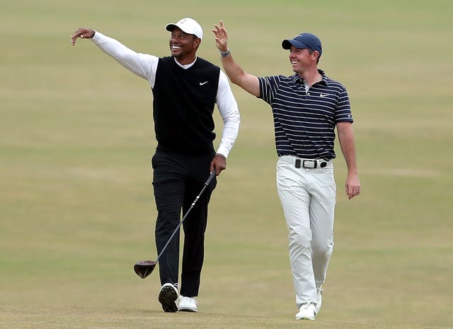 Tiger Woods (left) and Rory McIlroy waving at St Andrew's