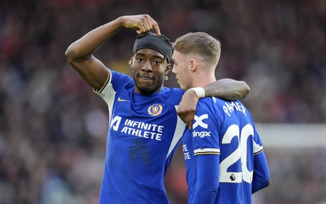 Noni Madueke, left, points to give the credit to Cole Palmer after scoring for Chelsea against Sheffield United