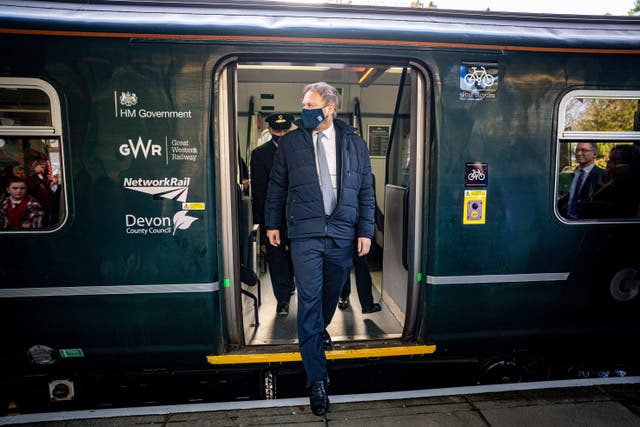 Transport Secretary Grant Shapps alights at Oakhampton station