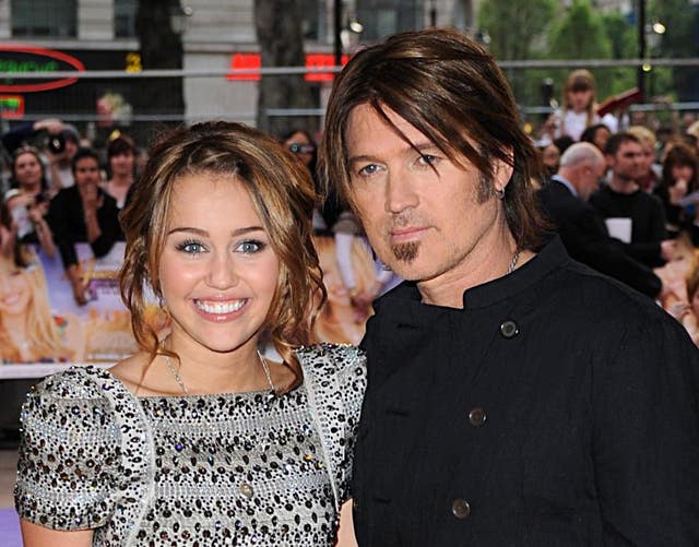 Miley Cyrus and her father Billy Ray Cyrus at the Hannah Montana UK premiere in 2009