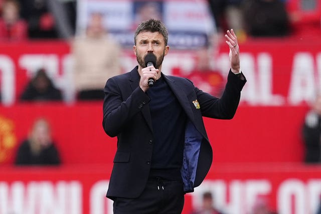 Manchester United manager Michael Carrick speaks to the fans after victory over Nottingham Forest