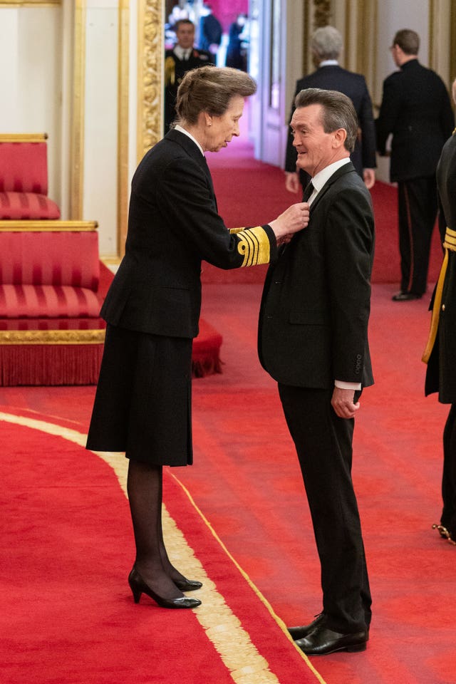 Feargal Sharkey receives an OBE (Officer of the Order of the British Empire) from the Princess Royal during an investiture ceremony at Buckingham Palace