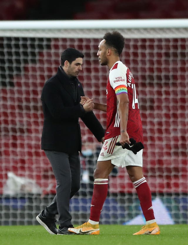 Mikel Arteta (left) dropped captain Pierre-Emerick Aubameyang (right) against Tottenham