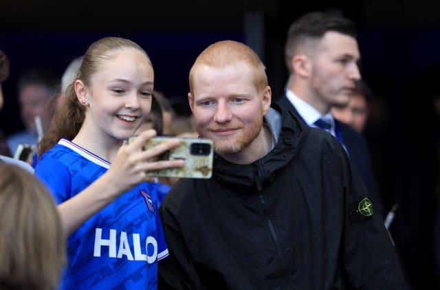 Ipswich Town fan Ed Sheeran poses for photos with fans after the Sky Bet Championship match at Portman Road, Ipswich