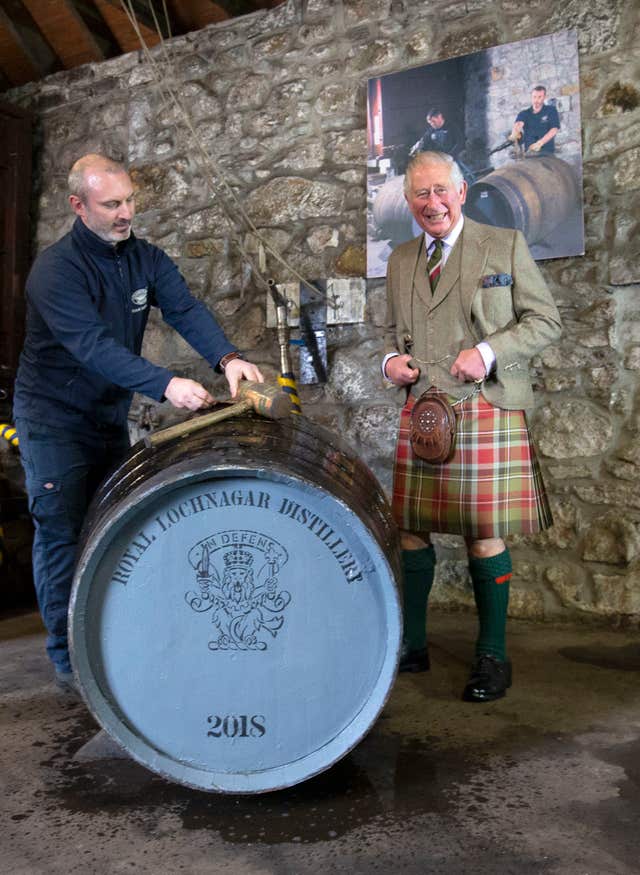 The Prince of Wales with a whisky cask
