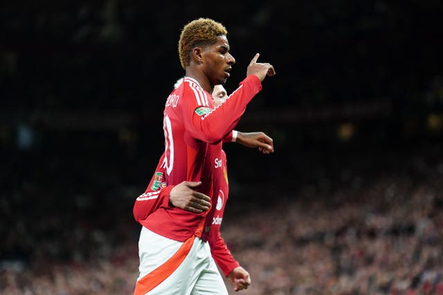 Marcus Rashford celebrates after scoring Manchester United’s first goal against Barnsley