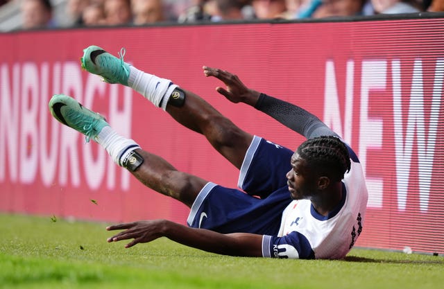 Tottenham’s Yves Bissouma falls towards the advertising hoardings during a pre-season friendly against Hearts