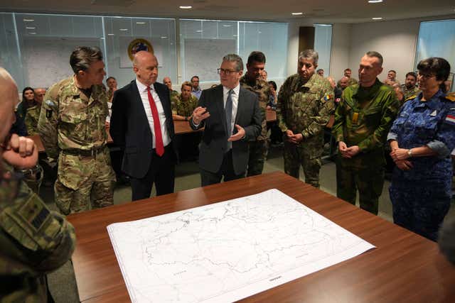 Sir Keir standing at a map with military personnel 