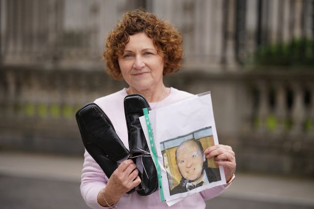 Marjorie Roddy holds the shoes of her uncle William McGreanery 
