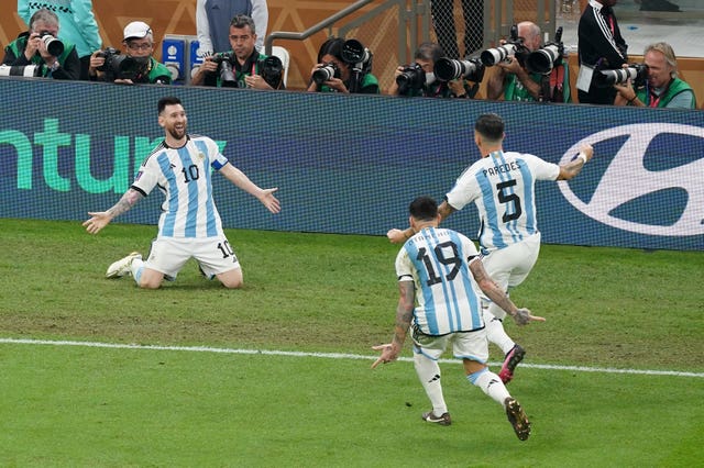 Lionel Messi, left, celebrates scoring Argentina’s third goal against France