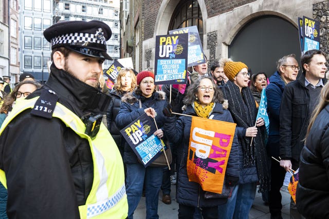 Members of the National Education Union (NEU) hold a rally outside the Department for Education (DfE) in London