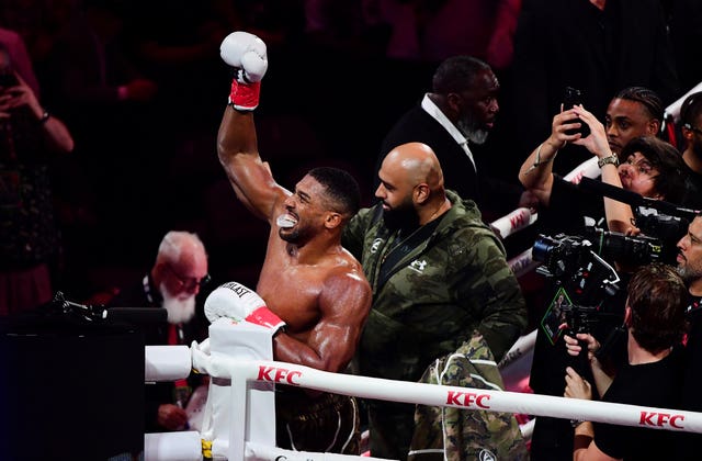 Anthony Joshua celebrates his win