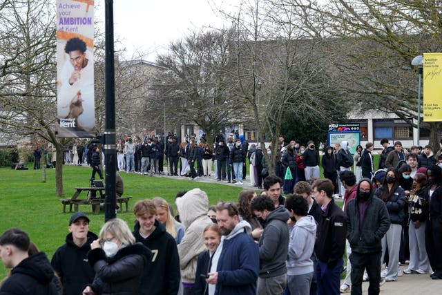 Students queuing for antibiotics outside a building at the University of Kent in Canterbury 