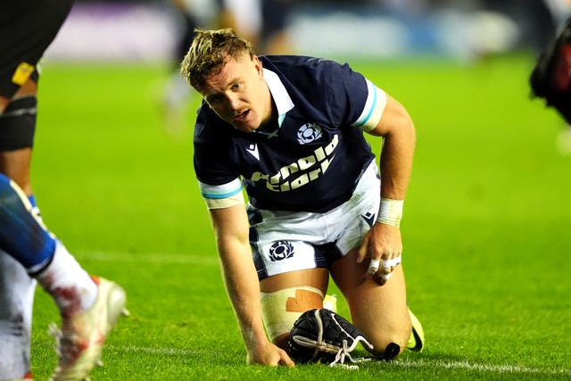 Scotland winger Darcy Graham on his knees after scoring his fourth try of the game against Fiji