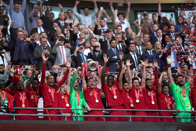 Jordan Henderson lifts the trophy at Wembley 