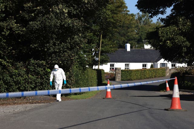 A police forensic officer at the scene following a shooting in the Ballsmill Road area of Crossmaglen
