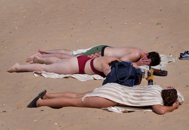 People enjoying the sun on the beach in Margate, Kent, on Sunday