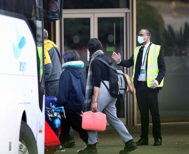 People arrive at the Renaissance London Heathrow Hotel, near Heathrow Airport