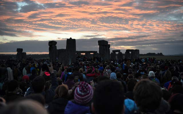 Summer solstice at Stonehenge is still a cause for celebration, but experts now believe building the monument was also important to ancient people (Andrew Matthews/PA)