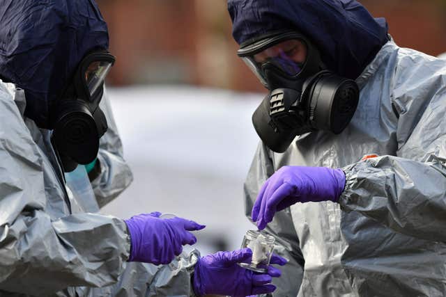 Police teams bag up swabs from railings outside The Maltings shopping centre, where former Russian double agent Sergei Skripal and his daughter Yulia were found critically ill (Ben Birchall/PA)