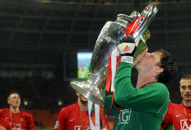 Edwin Van Der Sar celebrates with the Champions League trophy