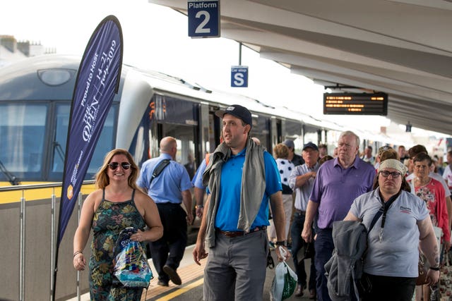 Golf fans and visitors getting off the train in Portrush