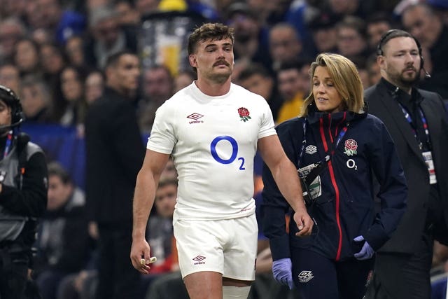 George Furbank, centre, looks dejected as he goes off injured during the Six Nations match against France