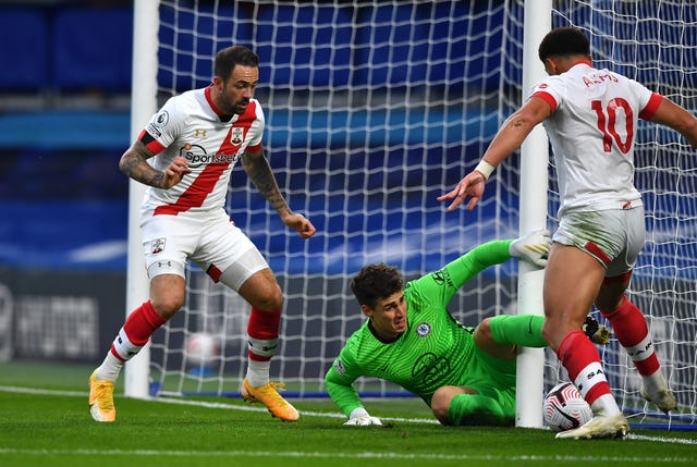 Southampton’s Che Adams, right, takes the ball around Chelsea goalkeeper Kepa Arrizabalaga