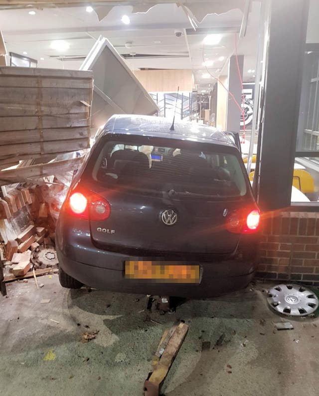 A car which crashed into a McDonald's restaurant at Buck Barn services on the A24 near Horsham