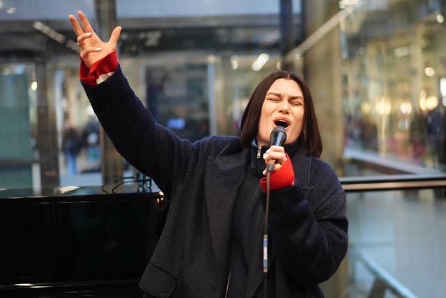 Singer Jessie J surprises travellers with a performance at St Pancras train station in central London