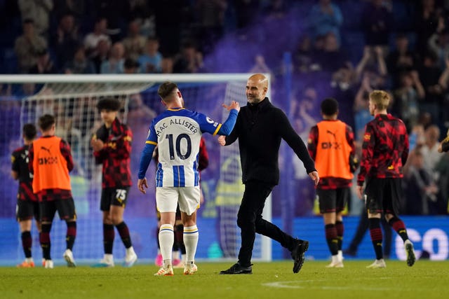 Pep Guardiola and Brighton midfielder Alexis Mac Allister after the final whistle