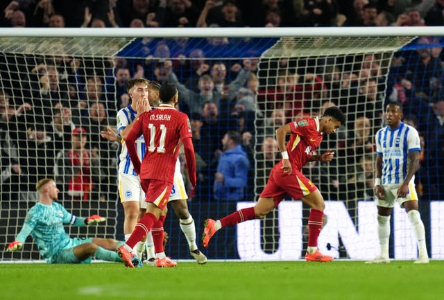 Luis Diaz runs off to celebrate after scoring Liverpool's third goal at Brighton