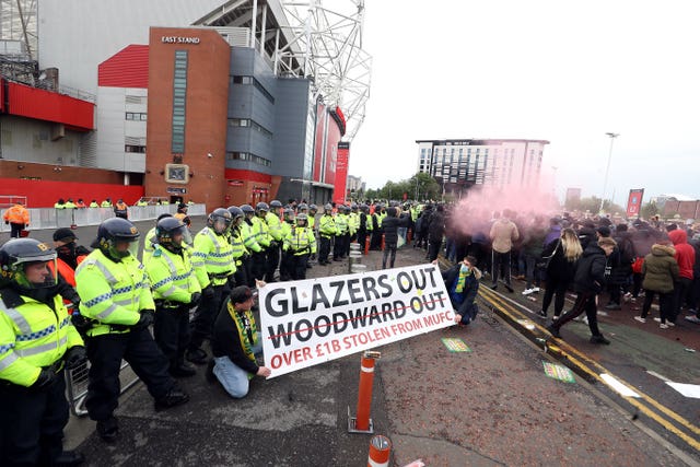 Manchester United fans outside the ground with police presence