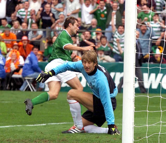 Jason McAteer wheels away after beating keeper Edwin Van der Sar to hand the Republic of Ireland a famous World Cup qualifier victory over the Netherlands