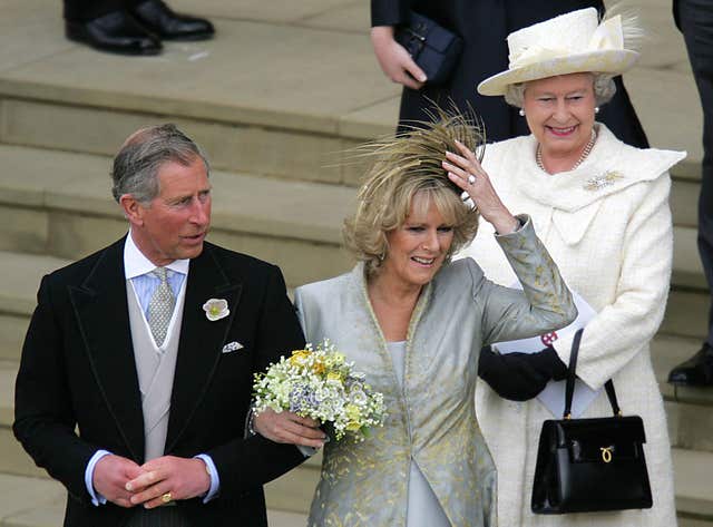 Charles and Camilla with the Queen on the West Steps of St George's Chapel (Odd Andersen/PA)