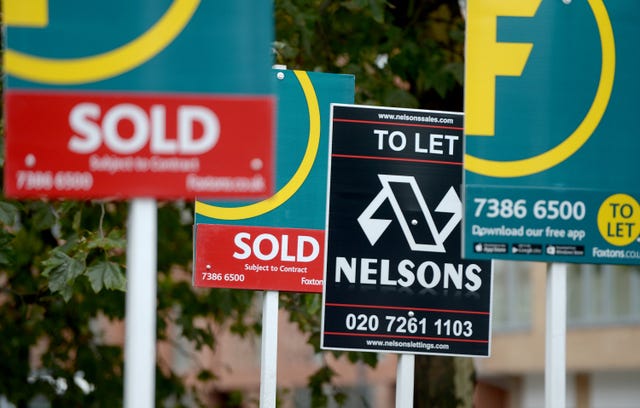 Street signs showing a property has been sold 