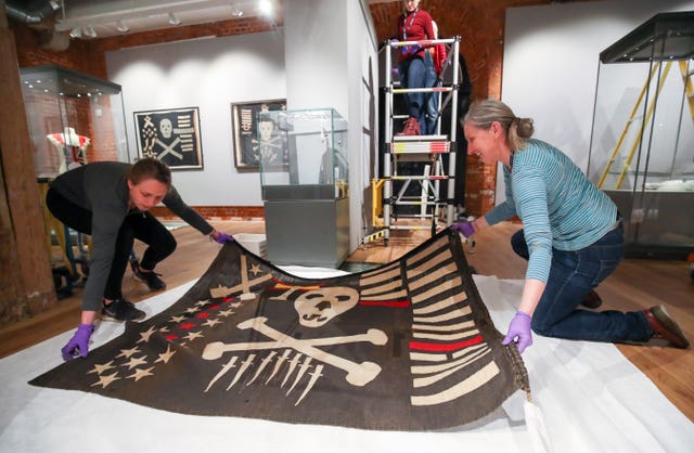 A Jolly Roger once flown by HMS Safari during the Second World War is unfurled